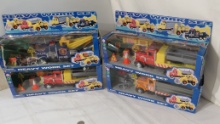 toy friction trucks including wrecker, (2) construction trucks with equipment, (1) dump truck