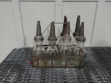 6 glass oil bottles w/ spouts & wire case
