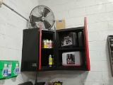 Contents of cabinet including fan on top