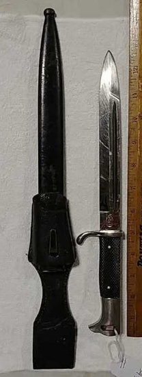 Military knife in scabbard