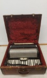 Petite keyed accordion in case