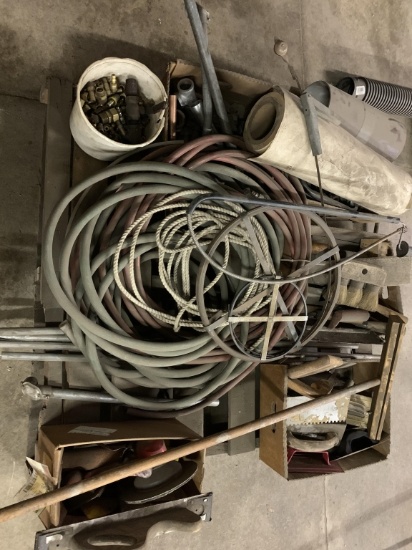 Pallet of trowels, sewer line rods, conduit PCs