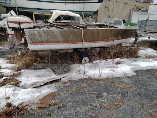 wooden boat with Johnson seahorse 35 motor and trailer