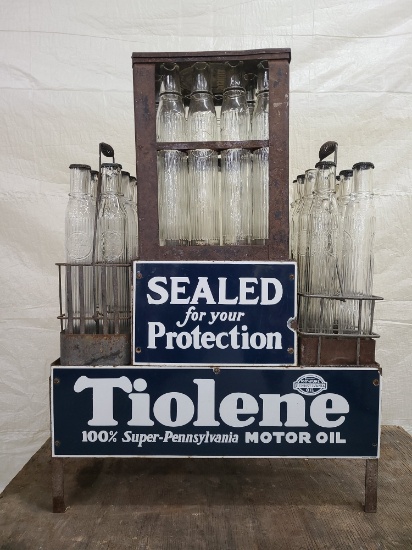 Tiolene Motor oil bottles and display stand with porcelain signs.