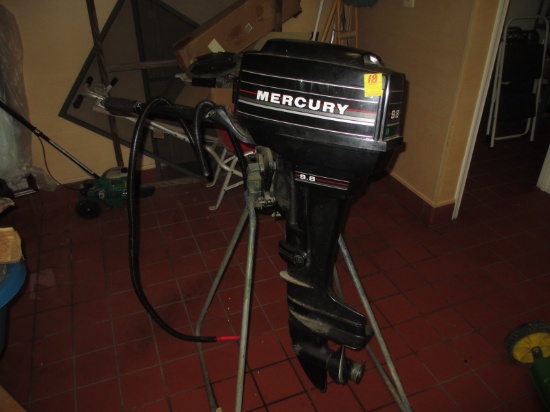 OUTBOARD MOTOR-MERCURY 9.8 WITH STAND AND COVER-NOT STUCK-CONDITION UNKNOWN
