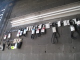 LOT-BELTS AND HOSES ON WALL AND IN BOX ON FLOOR