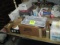 LOT- (2) TABLES WITH CONTENTS- STIRRERS/PLASTIC WRAP/TOOTH PICKS/FIRE EXTINGUISHERS/CRATES/STORAGE