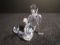 Swarovski crystal Mermaid holding a pearl in her hand.