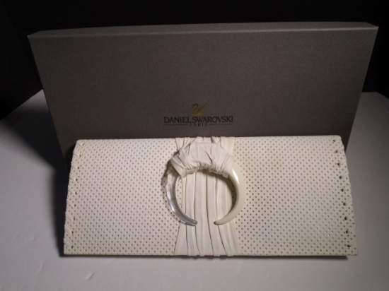 "Latitude" Daniel Swarovski White lambskin clutch. Has 1 zipper pocket inside. Brand new in original