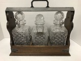 3 CRYSTAL DECANTERS IN WOODEN LOCKABLE CASE