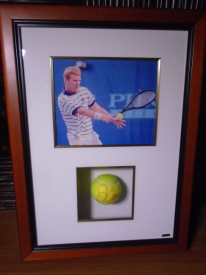 Jim Courier Framed Photo with Autographed Tennis Ball.