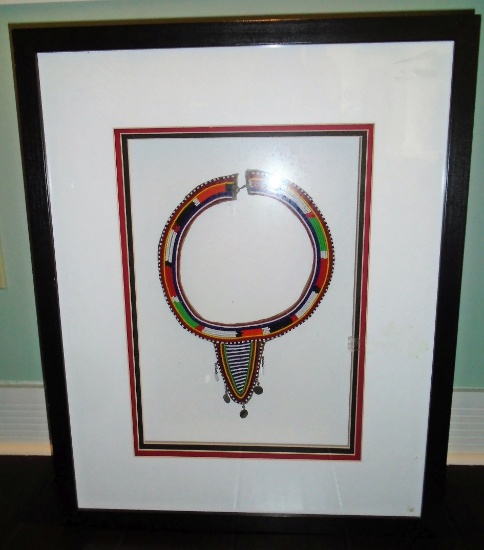 African beaded necklace in a shadow box frame.