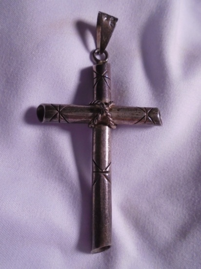 Sterling silver cross pendant.