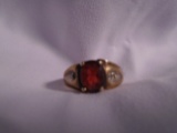 Ladies garnet and diamond ring