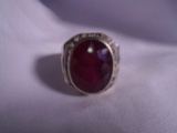 Sterling silver ring with an oval shaped center ruby