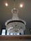 Clear crystal chandelier with gold trim, 12 lights.