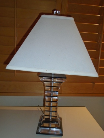 Lucite table lamp with off white lamp shade.