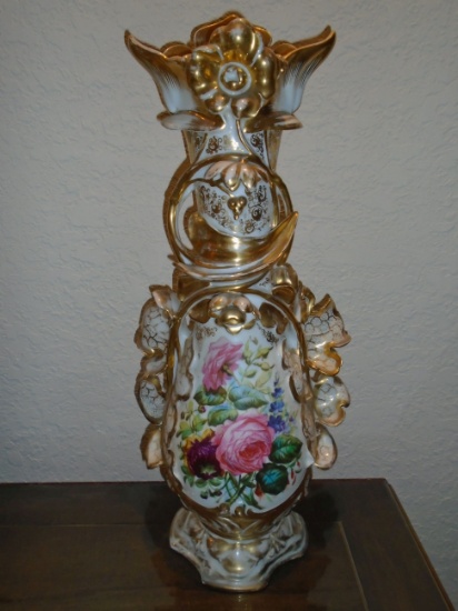 Large porcelain vase with floral design and gold details.