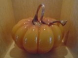 Glass pumpkin sculpture.