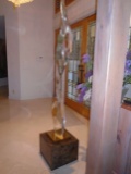 Tall Lucite sculpture on an emperador marble base.