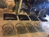 Set of (4)Lucite barstools with black cushioned seats.