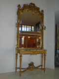 Grand entrance mirror & console with a marble top and gold frame.