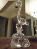 Crystal perfume bottle. Features a bird with long curly tail topper.