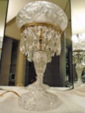 Crystal table lamp with crystal cut design and crystal lamp shade.