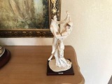 Tango Capodimonte porcelain figurine on a wood base.