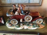 Capodimonte large porcelain figurine, 4 people in a vintage car.