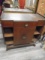 Antique wooden cabinet with drawer.