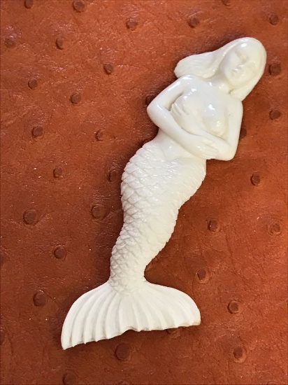 Antique timeless beautifully designed small ivory bone, carved figurine of a mermaid in a  beautiful