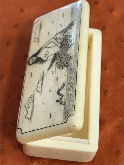 Antique miniature beautifully designed ivory bone box  with mermaid sitting in the miidle of the wav