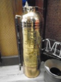 Antique Fire extinguisher, shiny copper.