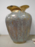 Ceramic vase with green glazing design.
