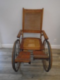 Antique wooden wheelchair.