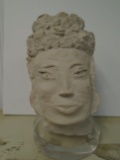 Hand sculpted clay, oriental head on an acrylic base.