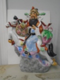 Large Porcelain figurine, oriental man riding a horse.