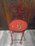 Small Antique chair, metal frame and wooden seat.