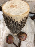 Antique handmade musical items - an old leather beautifully crafted 13â€ tall Drum and two maracas/
