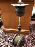 Antique ashtray on the rolling base in the form of a metal ball.