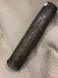 Old/used some kind of old metal shell of a real used artillery weapon.