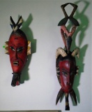 PAIR OF HAND-CARVED HAND-PAINTED WOODEN TRIBAL MASKS