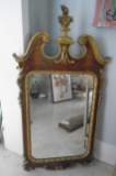 Vintage wood framed mirror with gold details.