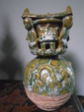 Hand sculpted oriental style glazed pottery.