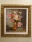 Oil Painting of a vase of flowers, in a gold frame.