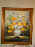 Oil Painting of flowers in a pot in a gold frame.