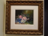 Oil Painting of a basket of flowers, in a gold frame.