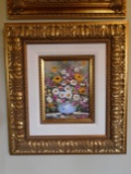 Oil Painting of a vase of flowers, in a gold frame.