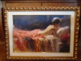 Embellished Gicle of a nude woman laying down, in a gold frame.